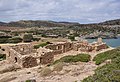 View north from excavated buildings on East Akropolis, overlooking beach and bay of Eremoupolis, with Itanos Promontory in the background