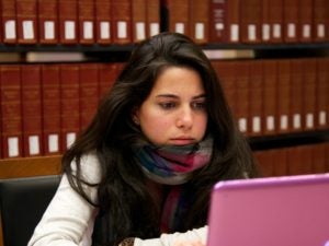 Student studying in the Williams Law Library at Georgetown Law.