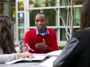 Students sharing knowledge outside the Scott K. Ginsburg Sport and Fitness Center.