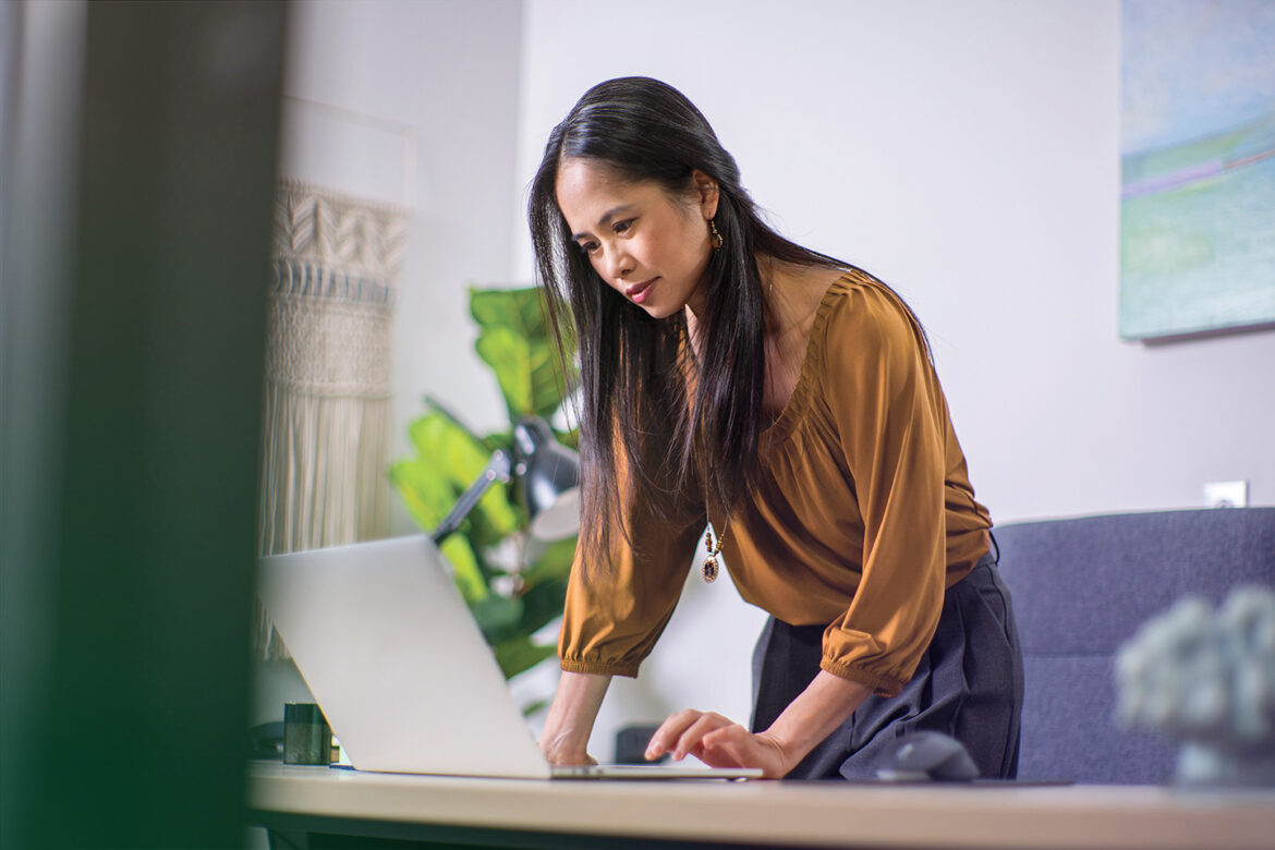 Female business owner using her laptop to explore small business banking solutions