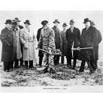 Group of men holding shovels to scoop the first shovel of soil at building groundbreaking.