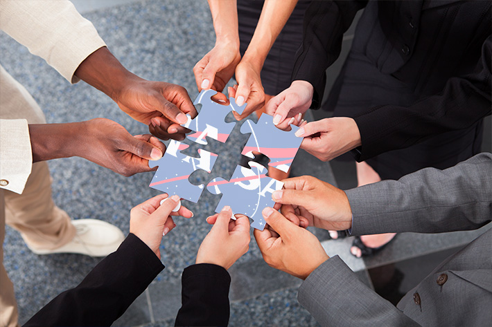 Hands holding puzzle with NASA letters