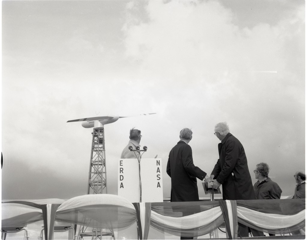 Bruce Lundin, and Jim Fletcher activating the wind turbine in 1975.