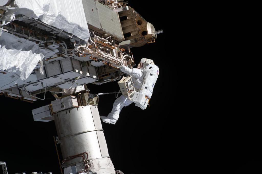 NASA spacewalker and Expedition 64 Flight Engineer Victor Glover works during a spacewalk on Jan. 27, 2021