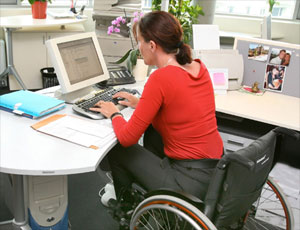 lady in a wheelchair working at a desk