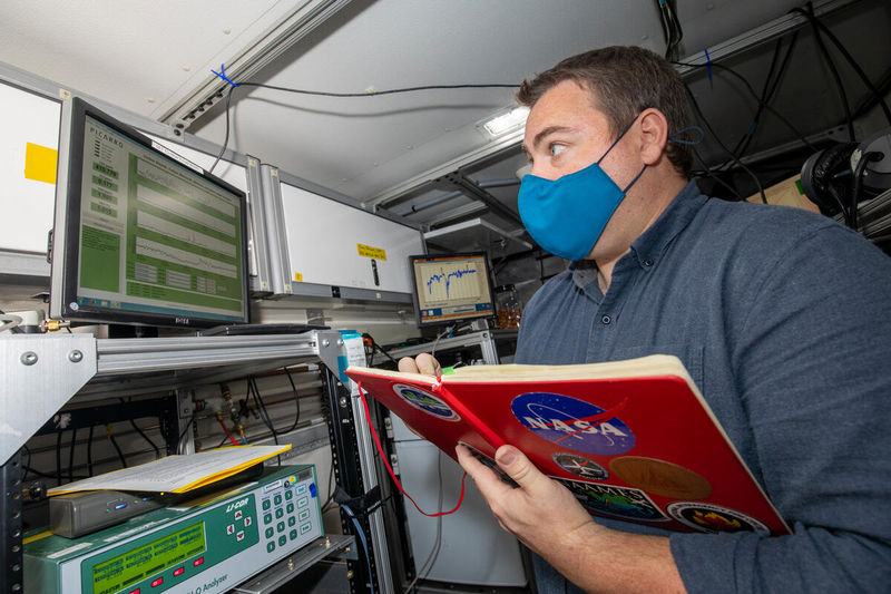 NASA’s Rich Moore monitoring data feeds inside NASA’s Mobile Lab.