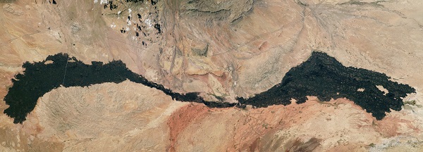 image of a lake and mountainous range on Earth as seen from the space station