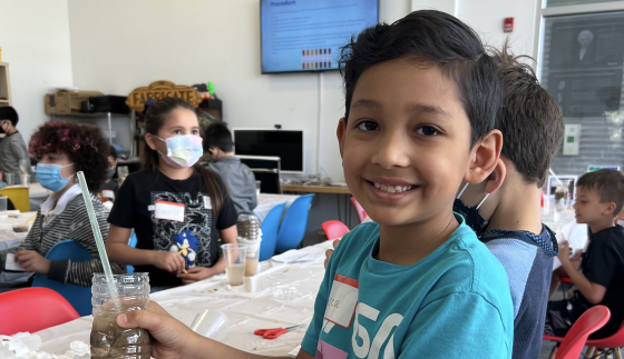 Lucca Soto works on his water filtration experiment using a variety of materials such as sand, rock, coffee filters, and more during a World Water Day event in March 2022 at Fab Lab El Paso