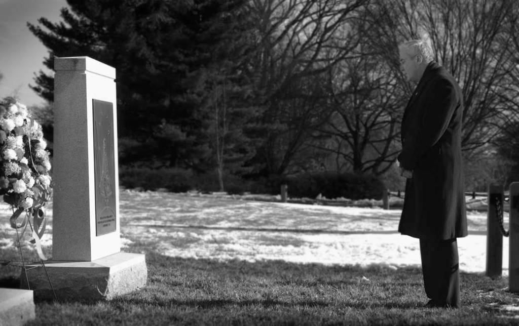 A man remembers Columbia at the monument in Arlington Cemetery