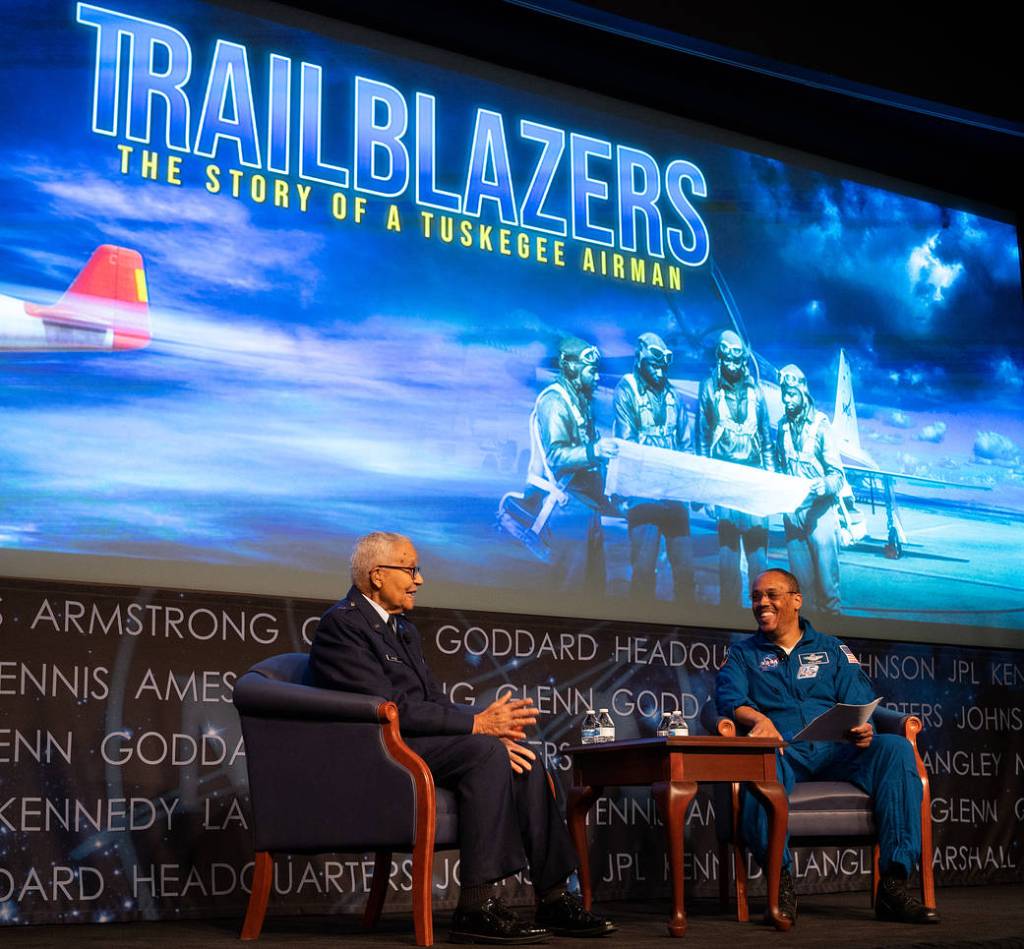 Brigadier General Charles McGee, left, speaks with NASA astronaut Alvin Drew 