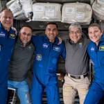 The seven-member Expedition 66 crew poses for a portrait