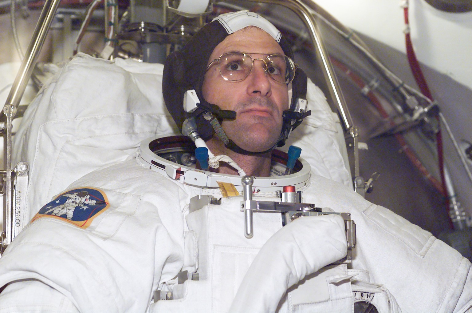 Pettit participates in an EMU spacesuit fit check.