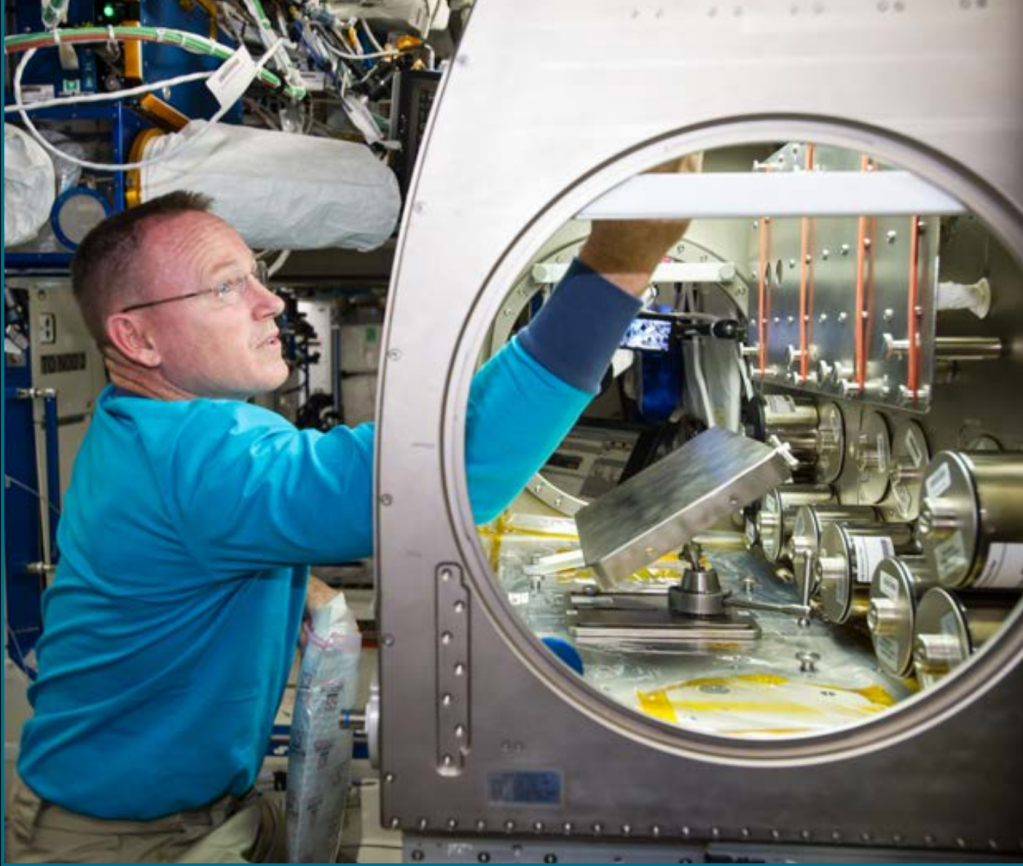 An astronaut performs ISS operations in support of the Rodent Research-1 validation flight in late 2014.