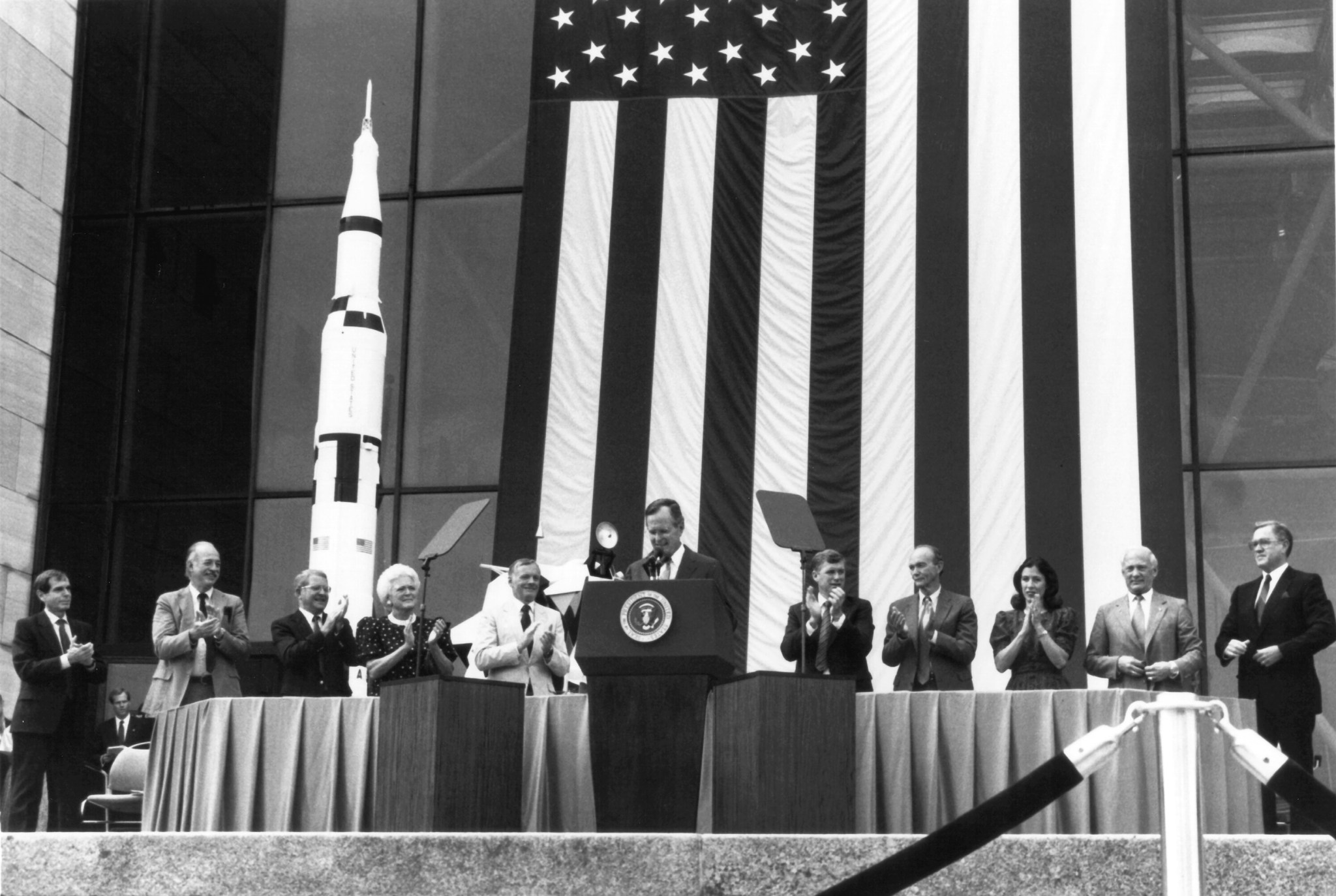 George H.W. Bush speaks on stage with the Apollo 11 astronauts at an event at the National Air and Space Museum.