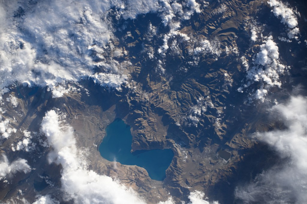 iss071e651951 (Sept. 15, 2024) -- Tucked in the Tibetan Plateau is Lake Paiku. The lake stretches 17 miles (27 km) long and 4 miles (6 km) wide at its narrowest point. As the International Space Station soared 259 miles above, NASA astronaut Mike Barratt captured this photo.