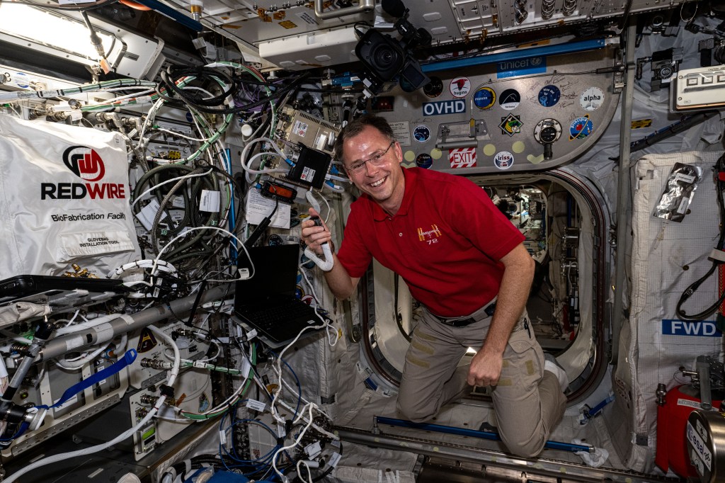 iss072e034816 (Oct. 11, 2024) -- NASA astronaut and Expedition 72 Flight Engineer Nick Hague is photographed while talking with students from Quebec, Canada, during an ISS Ham Radio session.