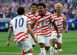 SUT-L-worldcup1-004 Christian Pulisic #10 and Weston McKennie #8 of the United States celebrate a goal, an own goal by Paraguay during a FIFA World Cup 2026 Group D match at Los Angeles Stadium on Friday. (K.C. Alfred / The San Diego Union-Tribune)